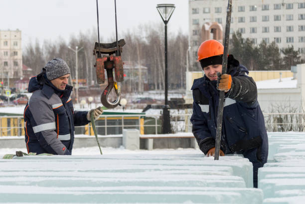 istock An assembly worker tries to push the ice slabs apart with a crowbar 1387410169