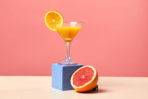 istock Fresh Citrus Juice on Pink 1387411382