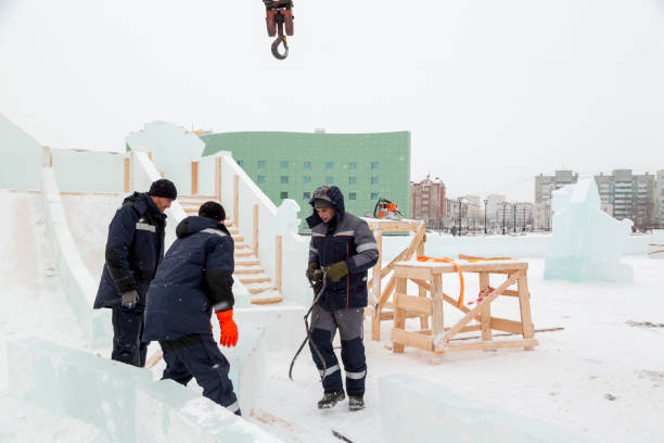 istock Workers are assembling ice blocks on the frame of a wooden slide 1387412418