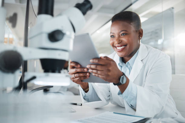 istock Shot of a young scientist using a digital tablet while working in a lab 1387412575