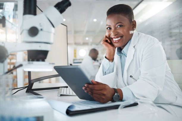 istock Shot of a young scientist using a digital tablet while working in a lab 1387412579