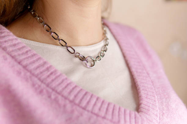 istock Silver necklace around her neck. Visual that can be used in e-commerce, online sales and social media. 1387412585