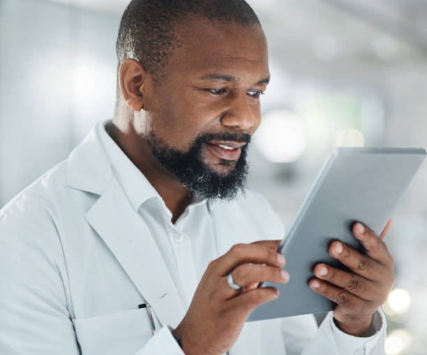 istock Shot of a male scientist using a digital tablet while working in a lab 1387412591