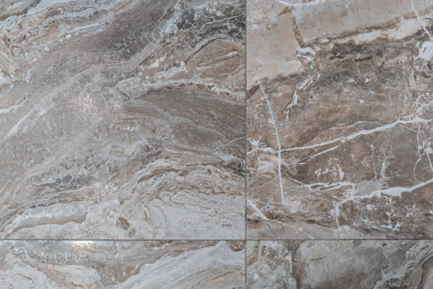 istock Tile on the floor is brown with a pattern of background texture. Granite tile stone ceramic tile. 1387413562