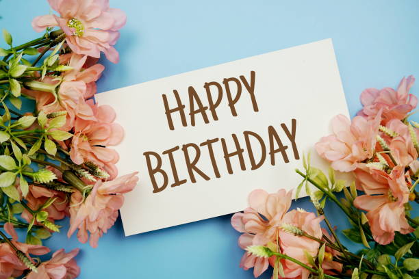 istock Happy Birthdaytext with flower frame on blue background 1387414873