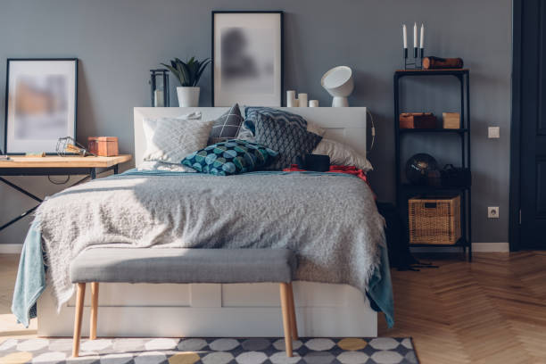 istock Large bed, home cozy interior bedroom in apartment. 1387415896
