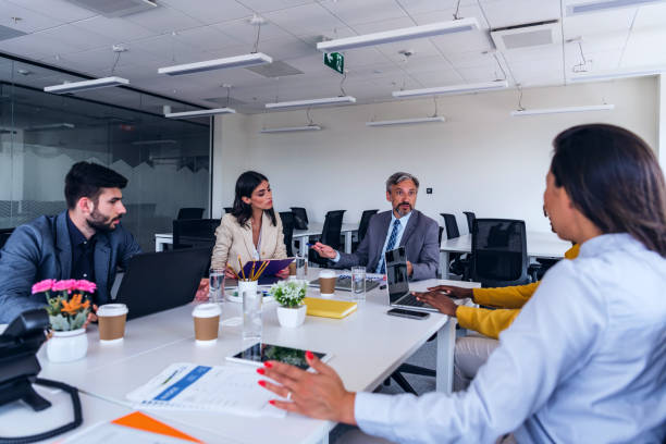 istock Corporate team working colleagues working in modern office 1387418272