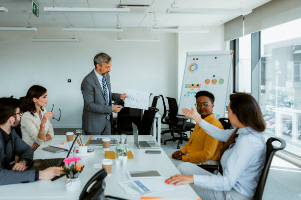 istock Business people working in conference room 1387418356