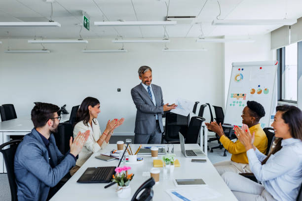 istock Business people working in conference room 1387418360