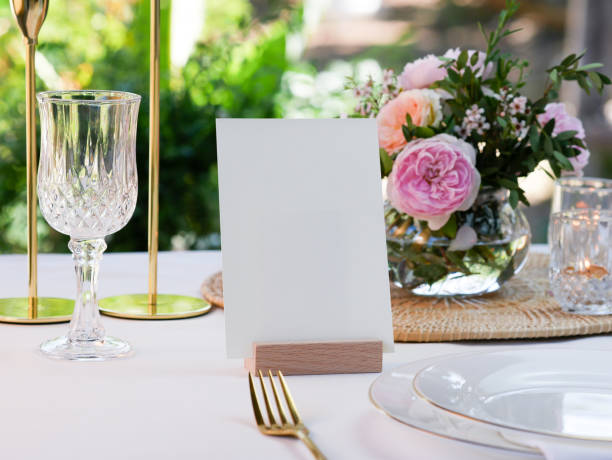istock Mockup white blank space card, for greeting,  wedding invitation template on wedding table setting background. with clipping path 1387419455