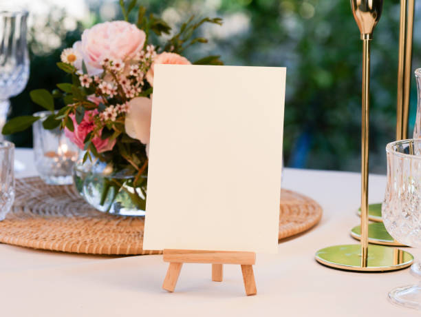 istock Mockup white blank space card, for greeting,  wedding invitation template on wedding table setting background. with clipping path 1387419457