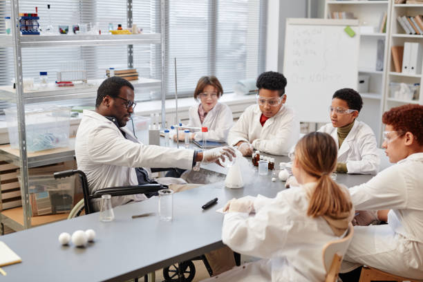 istock Teacher with Kids in Science Laboratory 1387422013