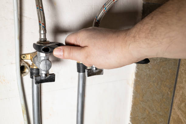 istock hand installs water stop tap by adjustable wrench 1387423797