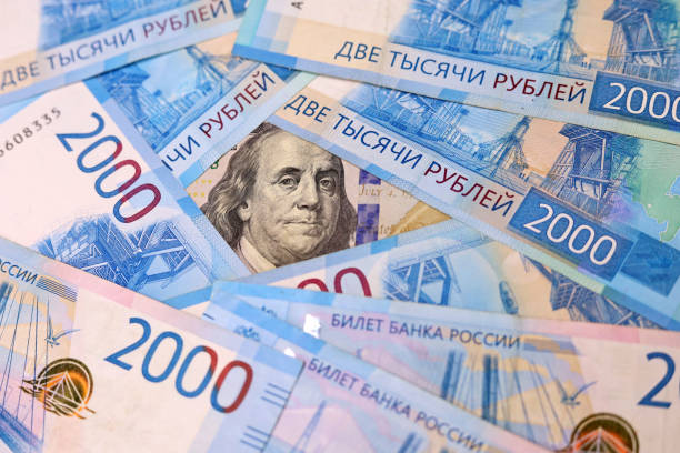 istock US dollar surrounded of russian rubles 1387423976