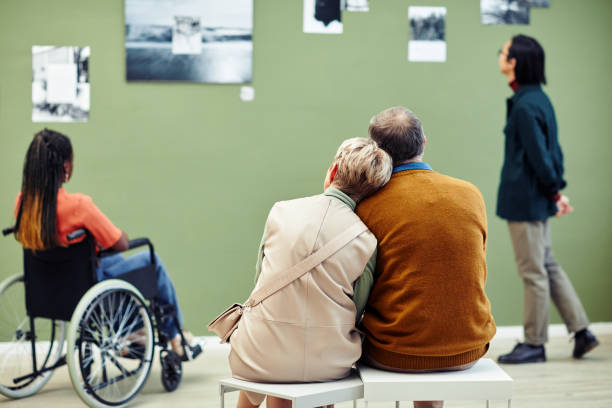 Senior Couple Sitting In Museum