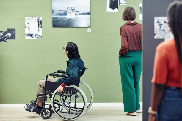 istock Students Visiting Photography Exhibition 1387425557
