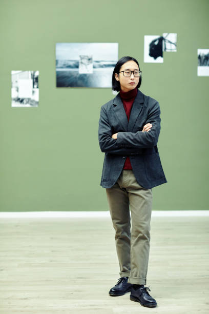 istock Young Asian Man In Art Gallery 1387425560