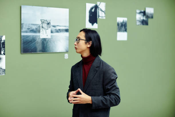 istock Asian Art Critic At Exhibition 1387425568