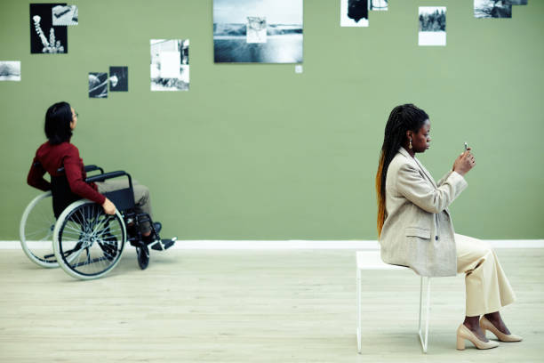 istock People Visiting Photography Exhibition 1387425619