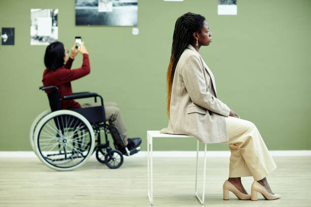 istock People At Photography Exhibition 1387425639