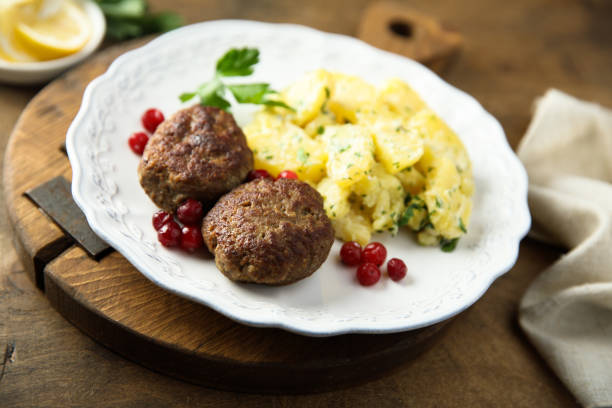 istock Meatballs with potato salad 1387428743