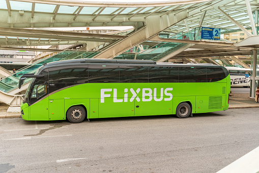 Green Flixbus coach at Oriente bus stop at the coach and Metro station concourse