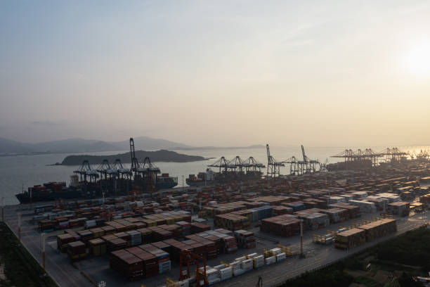 istock Commercial terminal with containers at sunset 1387430018