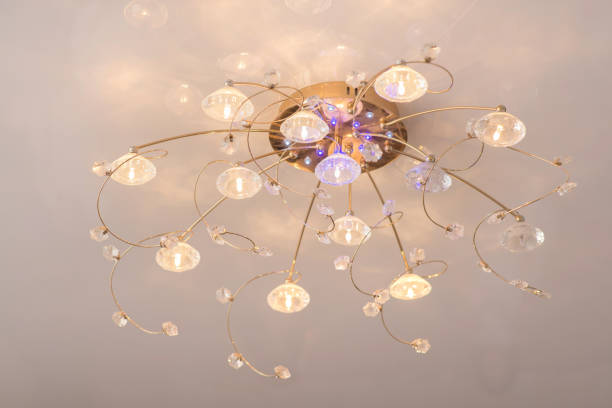 istock luminous electric chandelier under the ceiling, close-up, illumination 1387430221