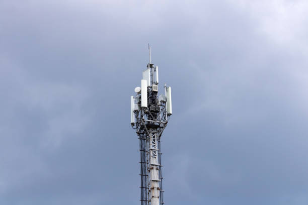 istock a telephone tower in a cloudy sky 1387430264