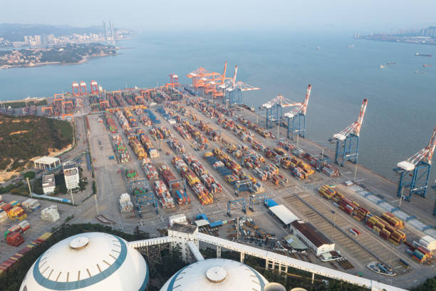 istock Commercial terminal with containers at sunset 1387430387