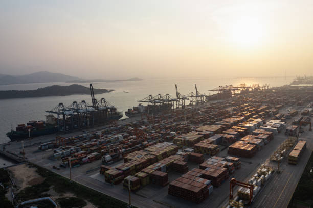 istock Commercial terminal with containers at sunset 1387431576