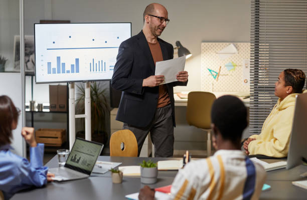 istock Businessman Presenting Project at Meeting 1387432857