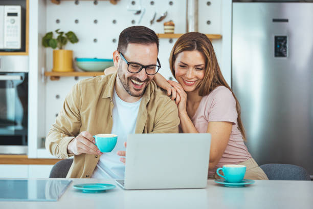 istock A pleasant family couple is sitting at a large kitchen table 1387434429