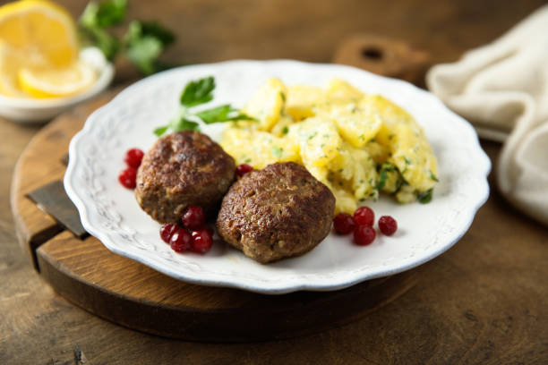 istock Meatballs with potato salad 1387435181
