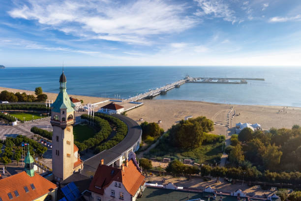 Holidays in Poland - view of the Sopot health resort in the morning Holidays in Poland - Sopot health resort in the morning with the longest wooden pier in Europe polish beach stock pictures, royalty-free photos & images