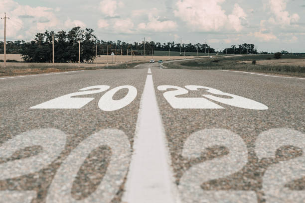 istock 2023 and 2022 written on paved road 1387437465