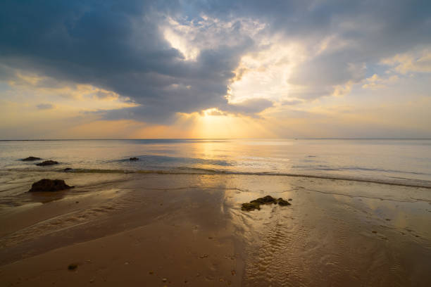 istock Seascape sunset. Shot of a beautiful sunset over the beach Background. 1387440708