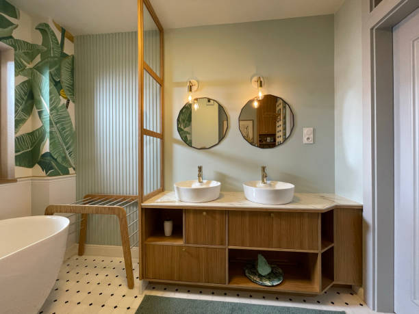 Big, luxury bathroom with two vanities Double bathroom for two. Plant pattern on the walls. vanity mirror stock pictures, royalty-free photos & images