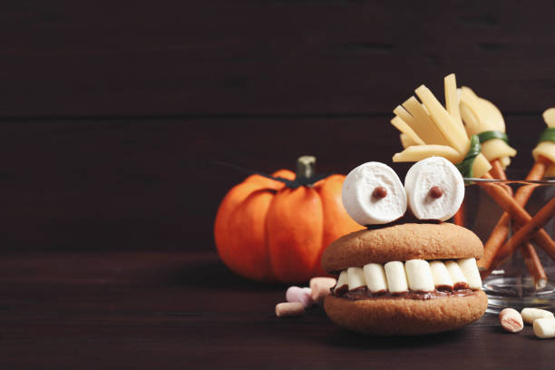 istock Delicious Halloween themed dessert on wooden table. Space for text 1387444215