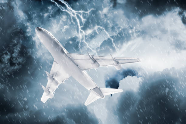 istock Airplane flying in cloudy sky during thunderstorm 1387445307