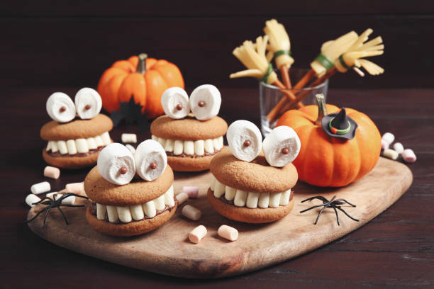 istock Delicious Halloween themed desserts on wooden table 1387445372