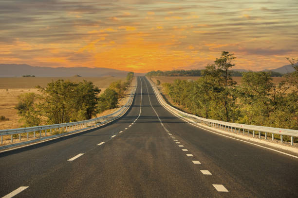 istock Beautiful view of empty asphalt highway. Road trip 1387446040