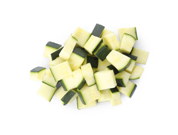istock Pieces of ripe zucchini on white background, top view 1387446044