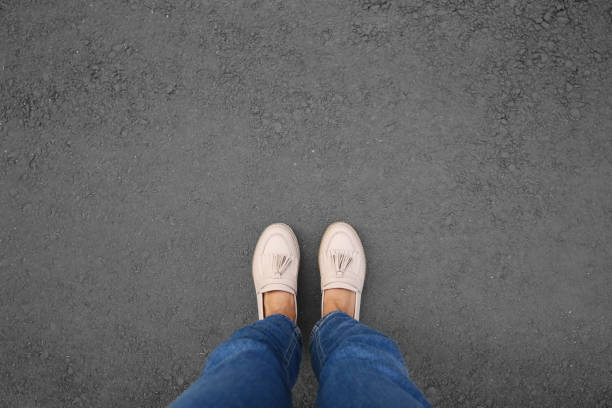 Woman standing outdoors, top view. Space for text