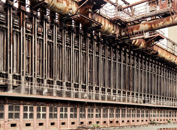 battery with coke ovens and coking ovens in a former large coking plant for refining coal. - rust metal imagens e fotografias de stock