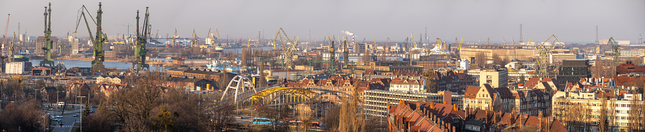 Panorama of Gdansk city centre and shipyard in a sunny day. View from above.