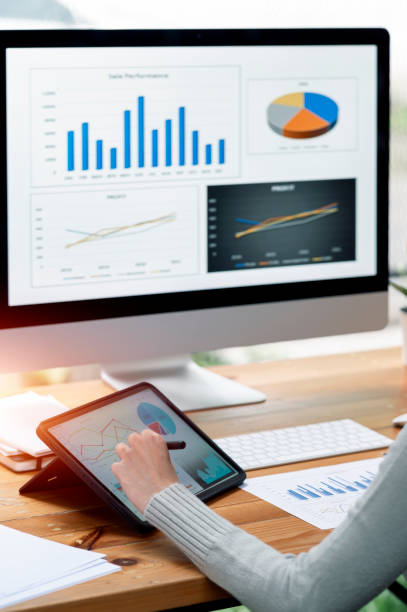 istock Businesswoman working at office with document on her desk, doing planning analyzing the financial report, business plan investment, finance analysis concept. 1387451438