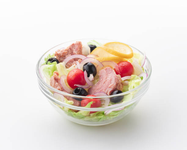 istock Salad with tuna on a white background 1387453571