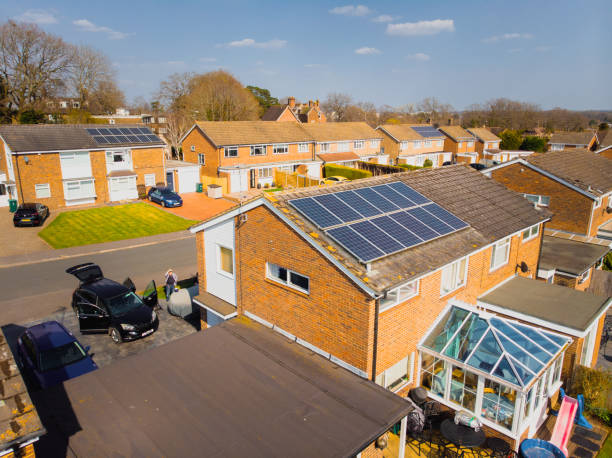 High angle view of semi detached house with solar panels on rooftop stock photo