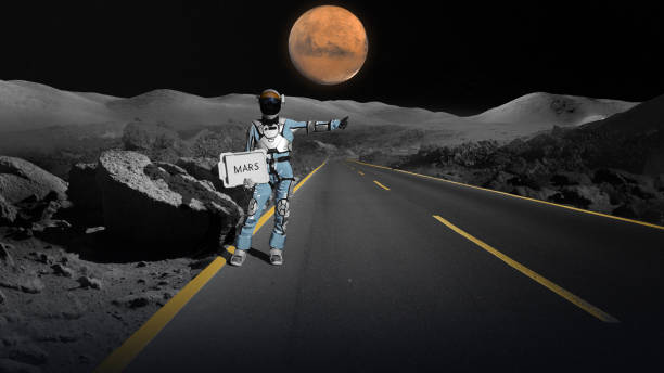 istock Astronaut hitchhiking in space holding 'mars' sign. Going home 1387453772